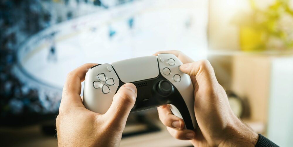 person holding ps5 controller