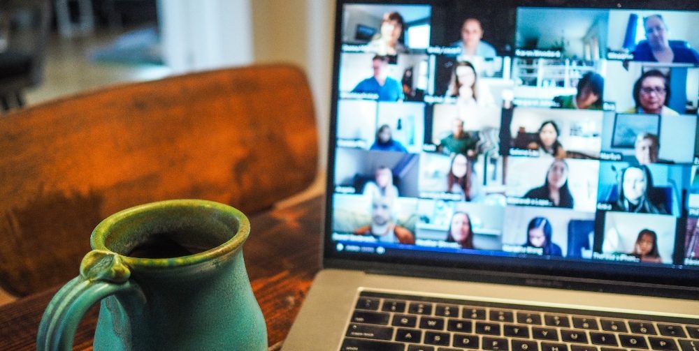 people on zoom with blue cup on table